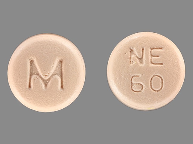 Orange Round pill with imprint M;NE;60 — Nifedipine Nifedipine 60 mg; (view 2)